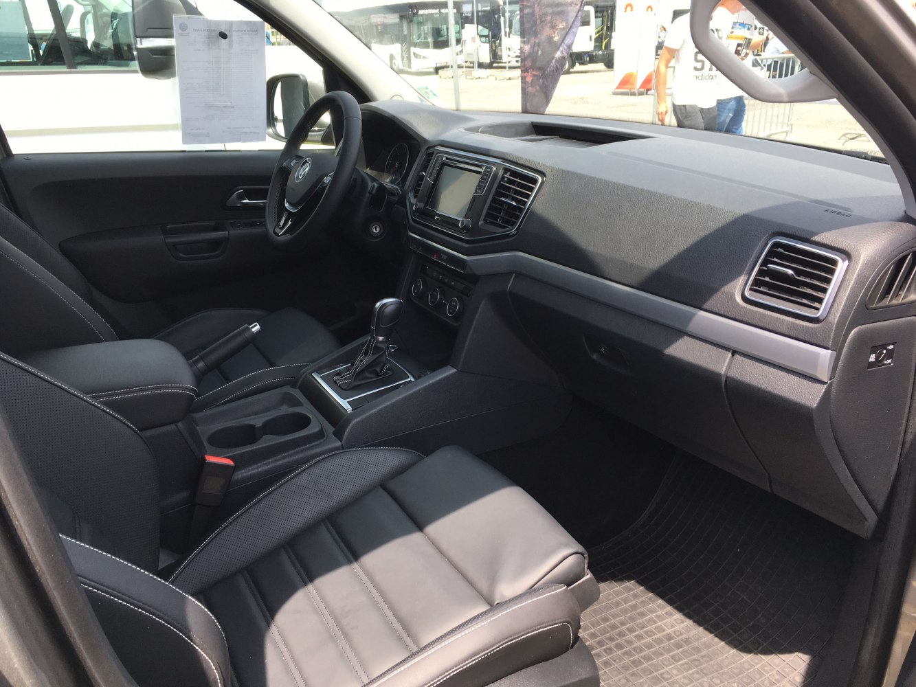 Interior dashboard and front seats with gear shift and controls