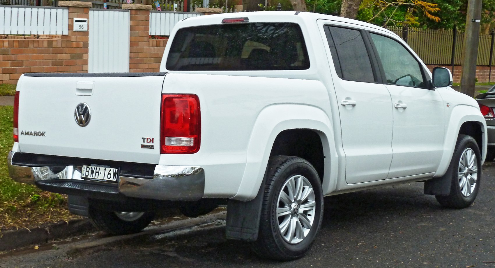 Rear and side view of double cab pickup with TDI badge.