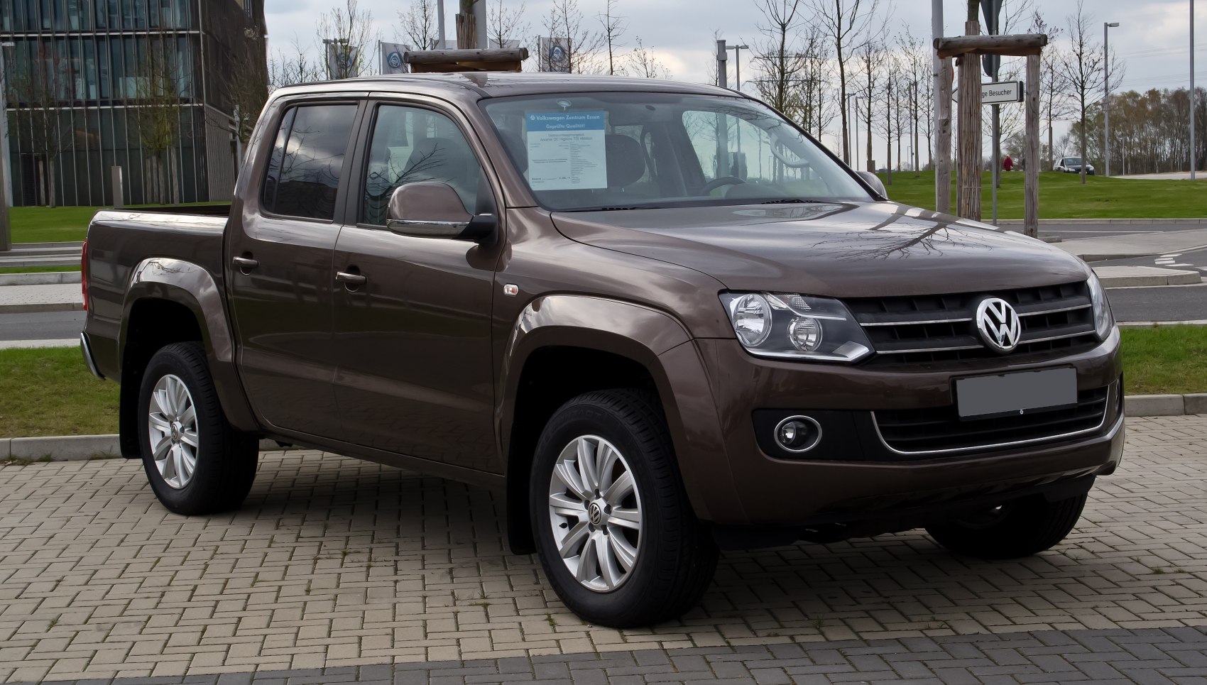 Front-side view of a double cab pickup truck with alloy wheels