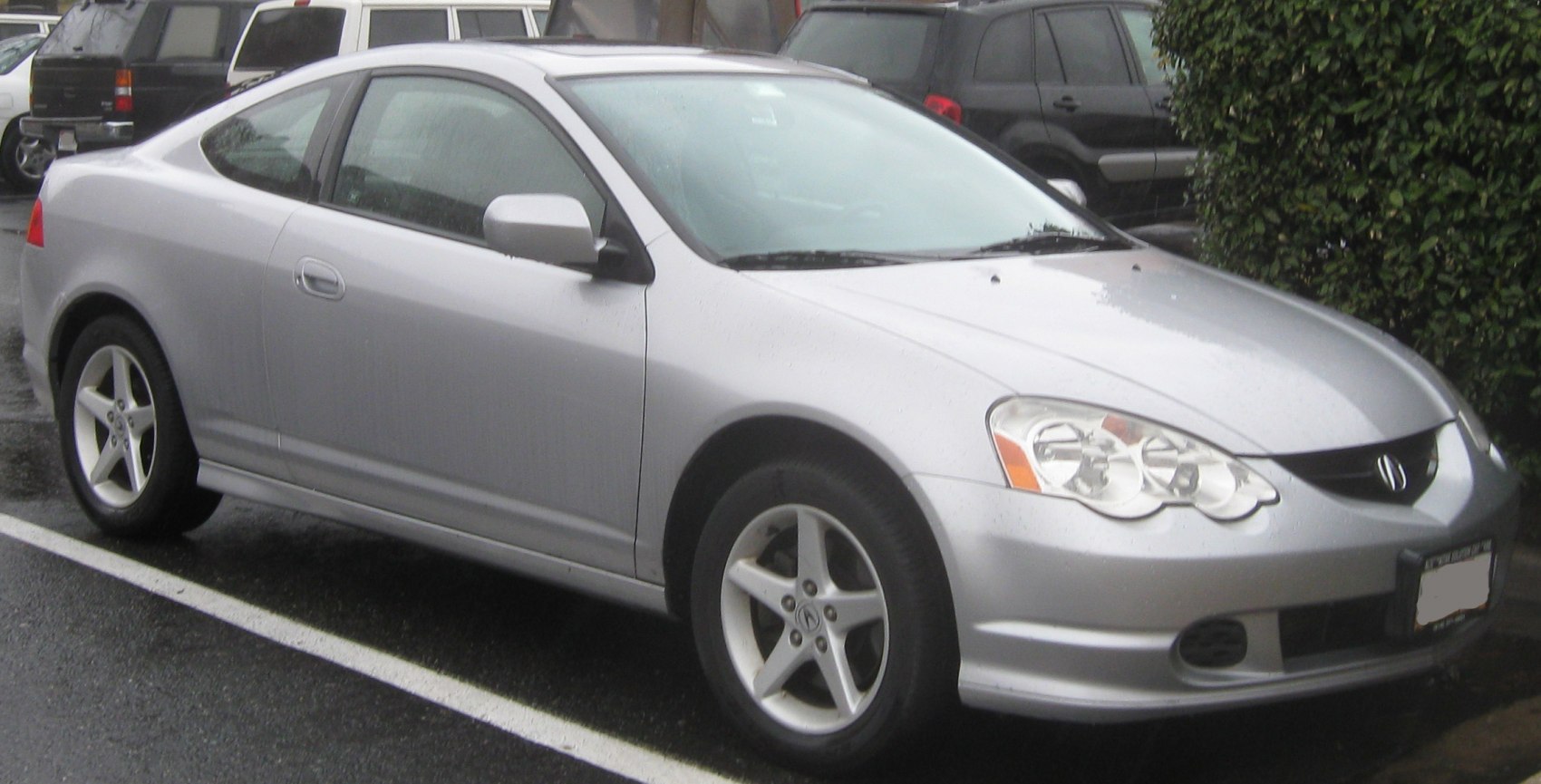 Silver coupe with aerodynamic profile and detailed front headlights
