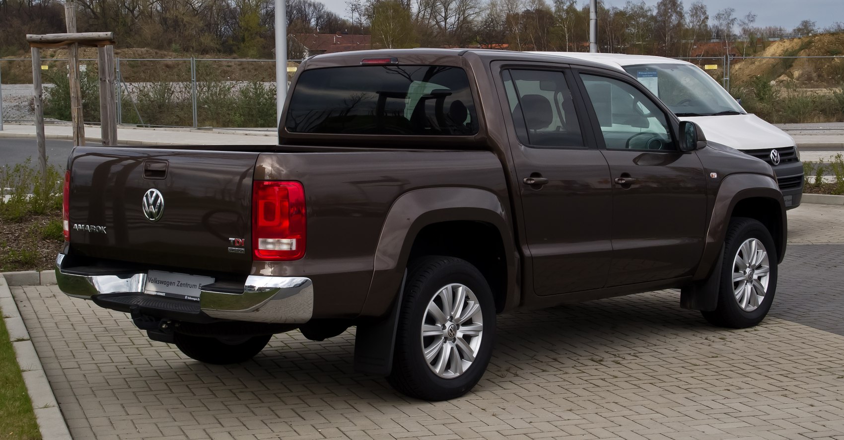 Rear and side view of a double cab pickup with tailgate and alloy wheels