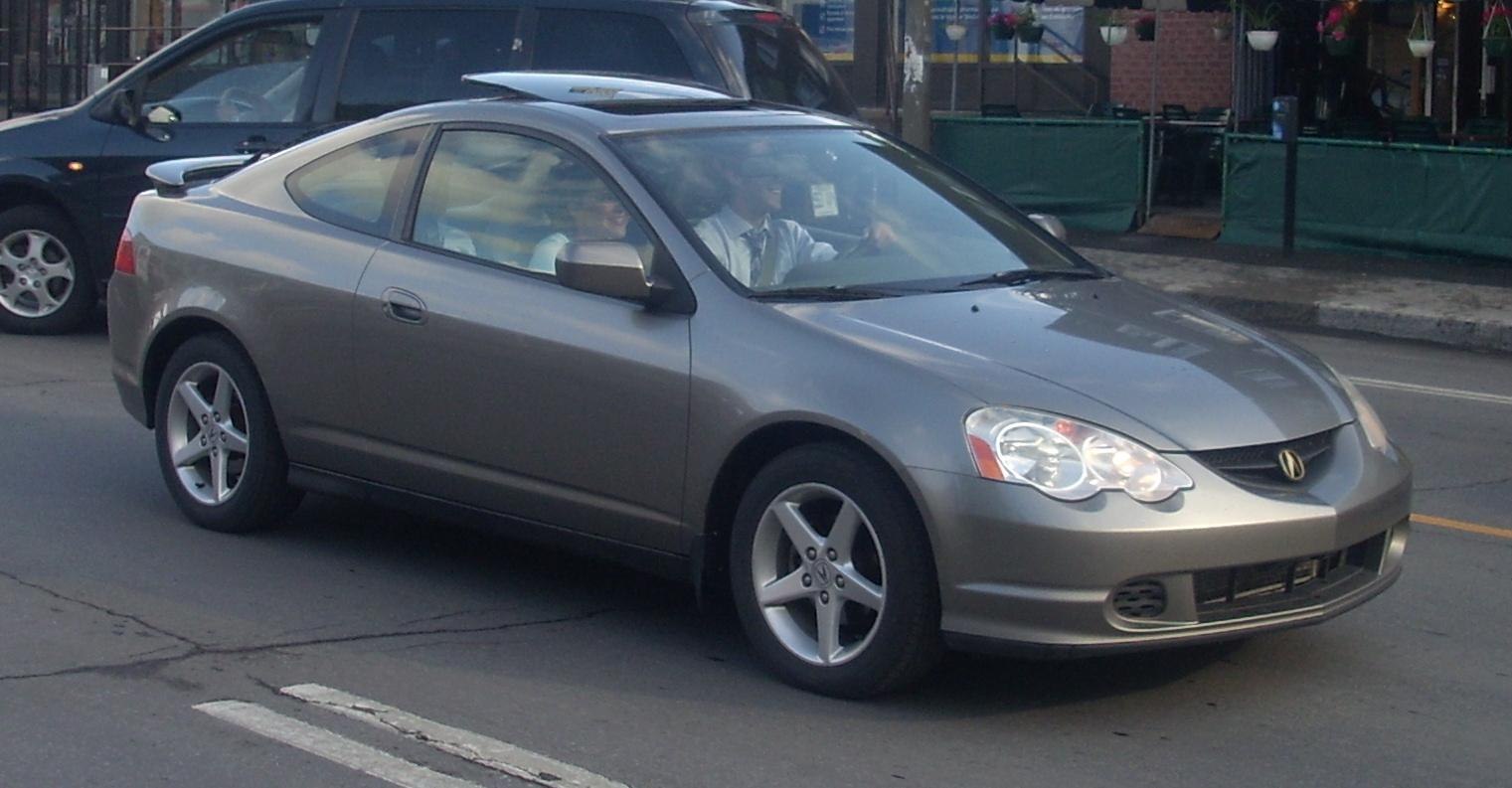 Front side view of a two-door sporty coupe with alloy wheels