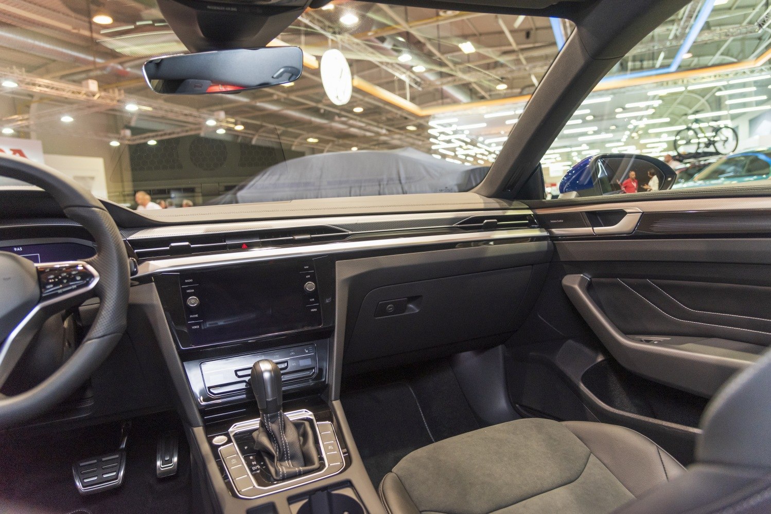 Modern dashboard and gear shift interior with infotainment screen and control buttons