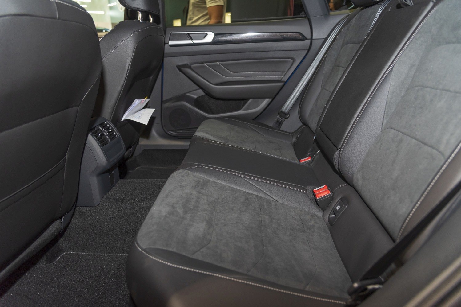 Rear seat upholstery and interior space with air vents and door panel detail