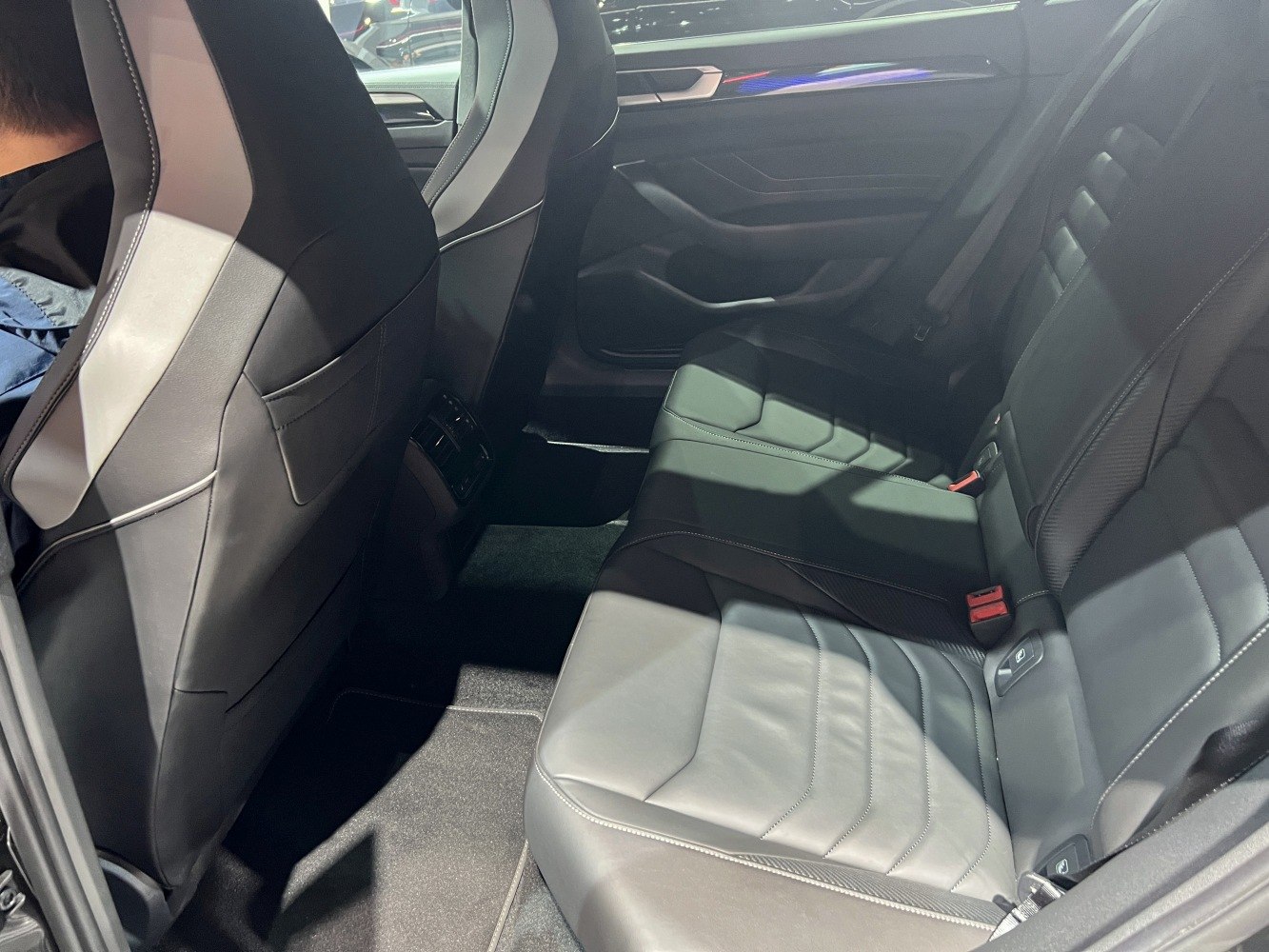 Spacious rear black leather seating with modern design and comfort features.