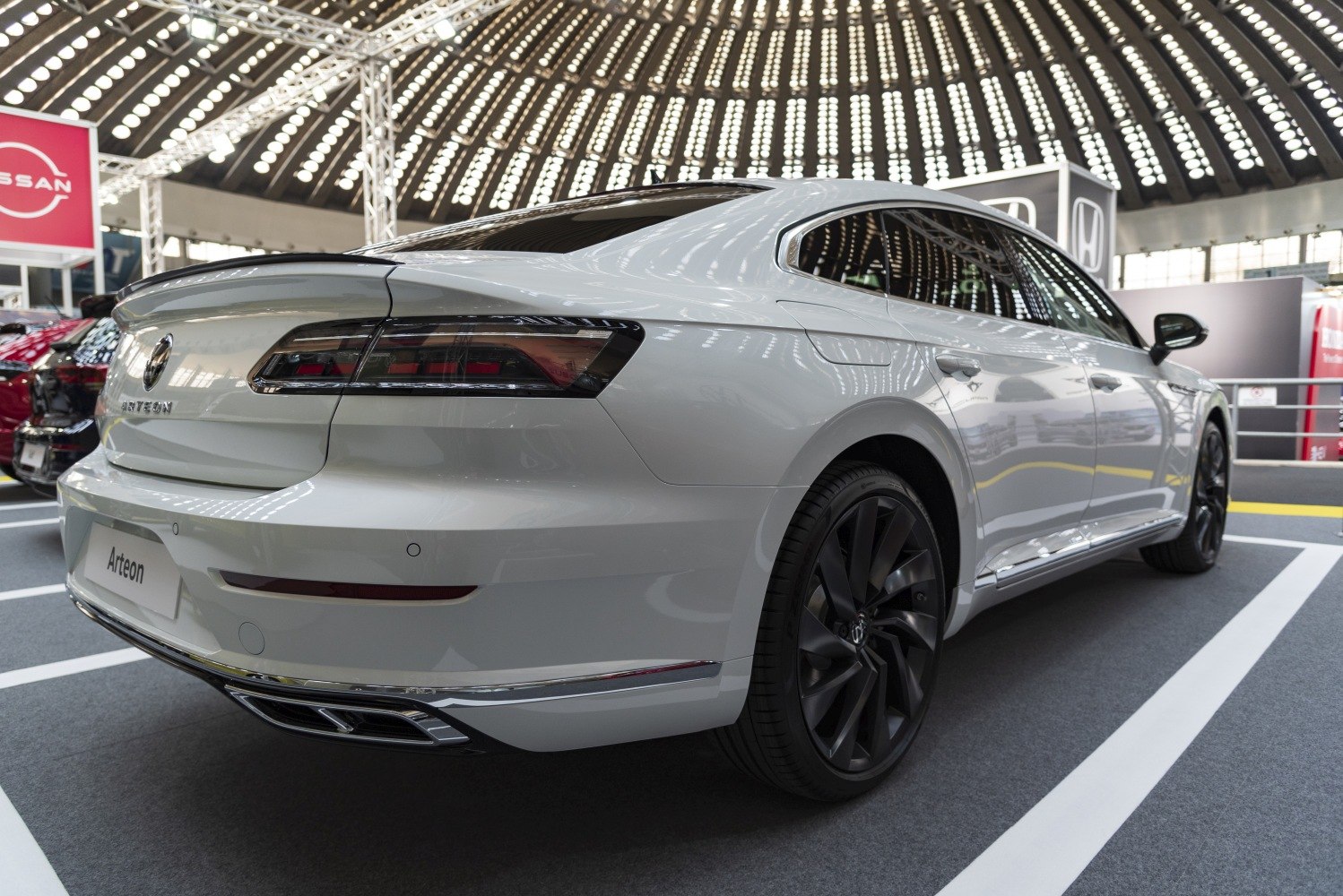 Sleek rear design and black alloy wheels of a luxury sedan