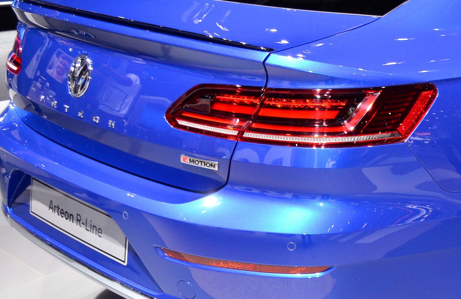 Close-up of rear tail light and 4MOTION badge on blue vehicle