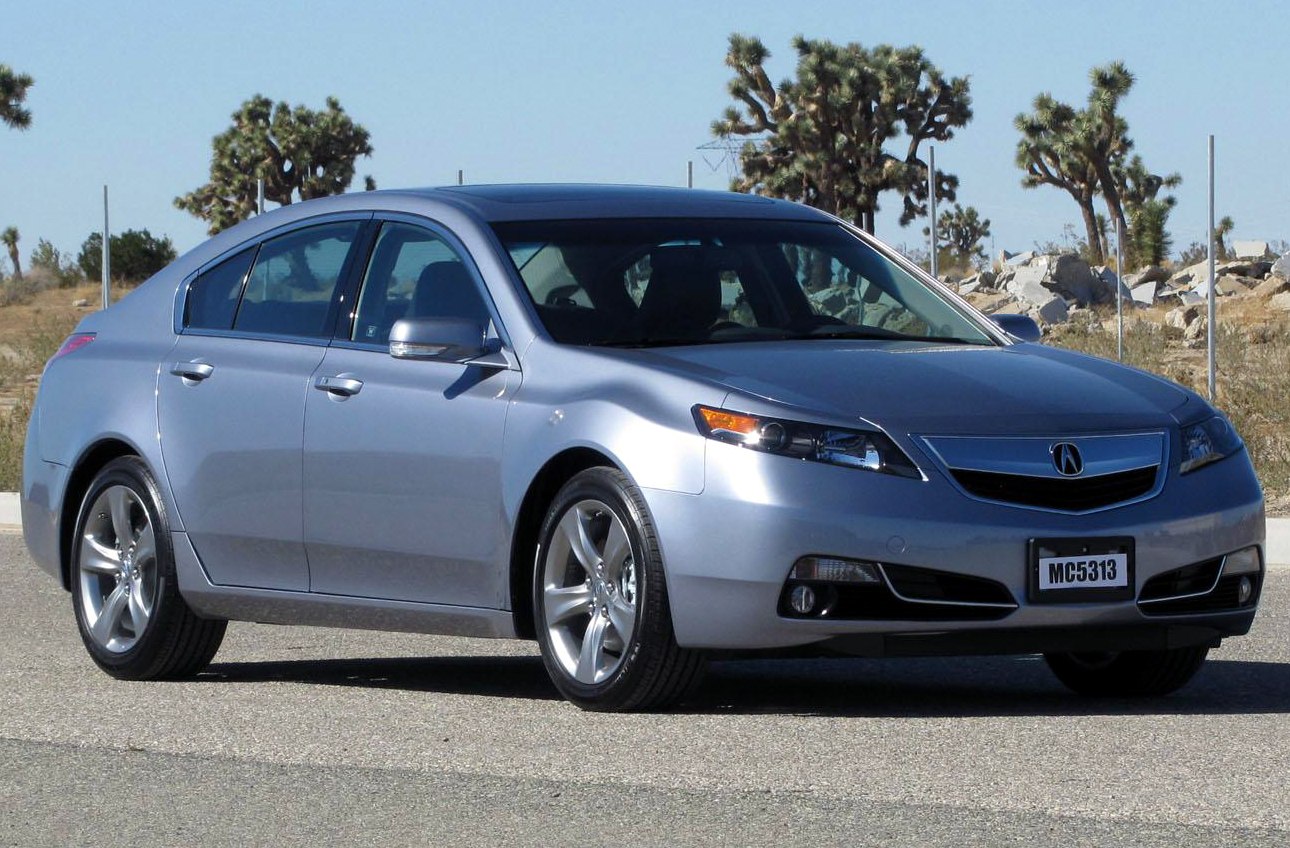 Silver mid-size sedan with sleek headlights and front grille