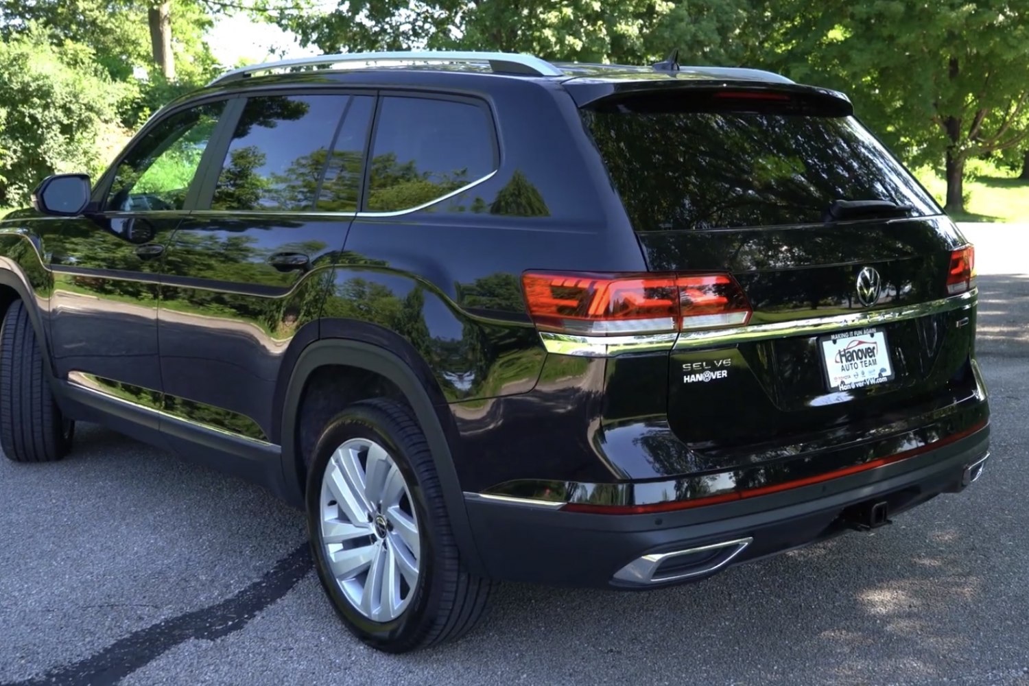 Rear and side view of a black SUV with modern taillights and alloy wheels