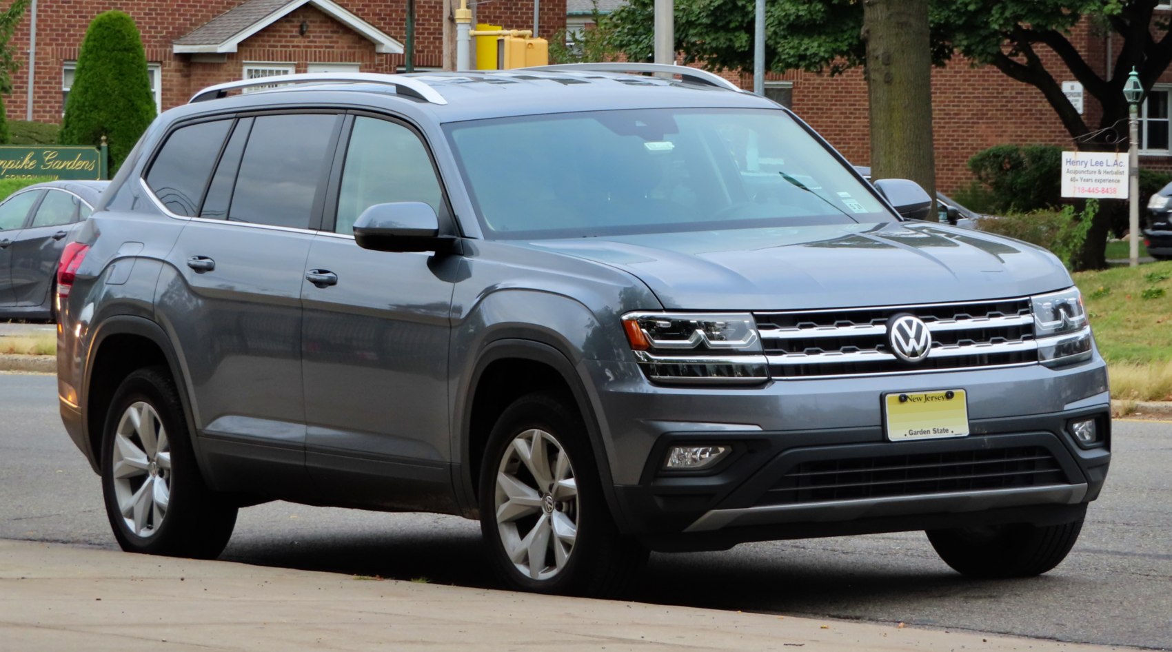 Gray mid-size SUV showing front and side profile with roof rails.