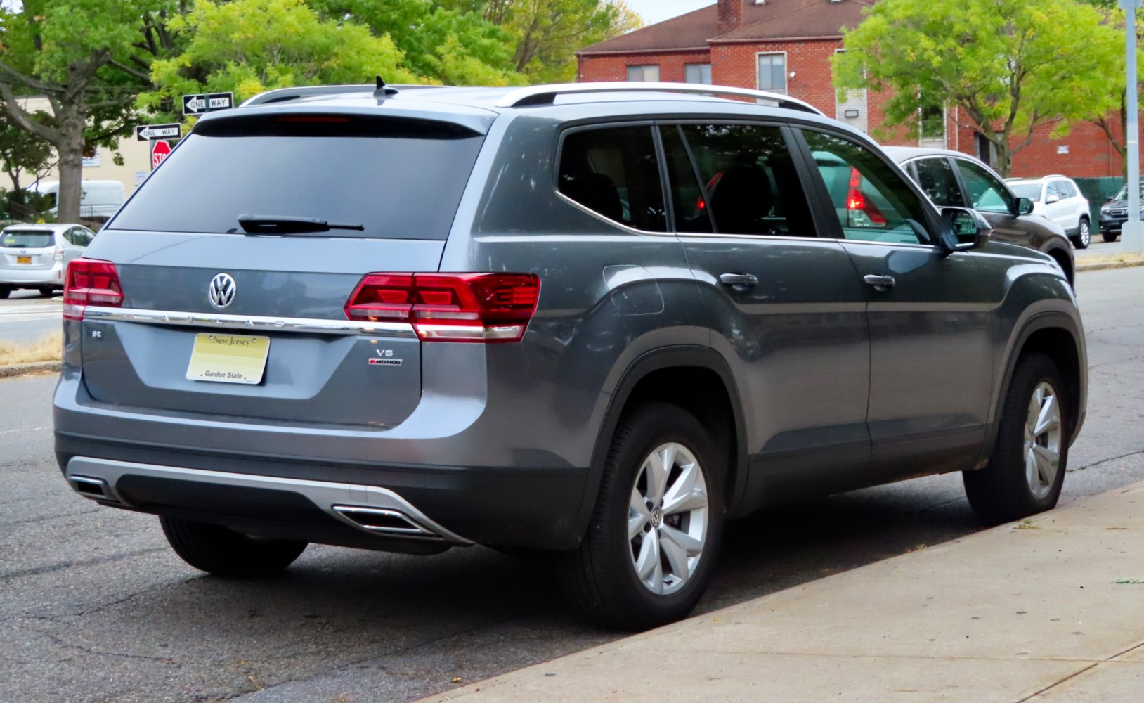 Rear and side profile with V6 badge and distinctive taillights