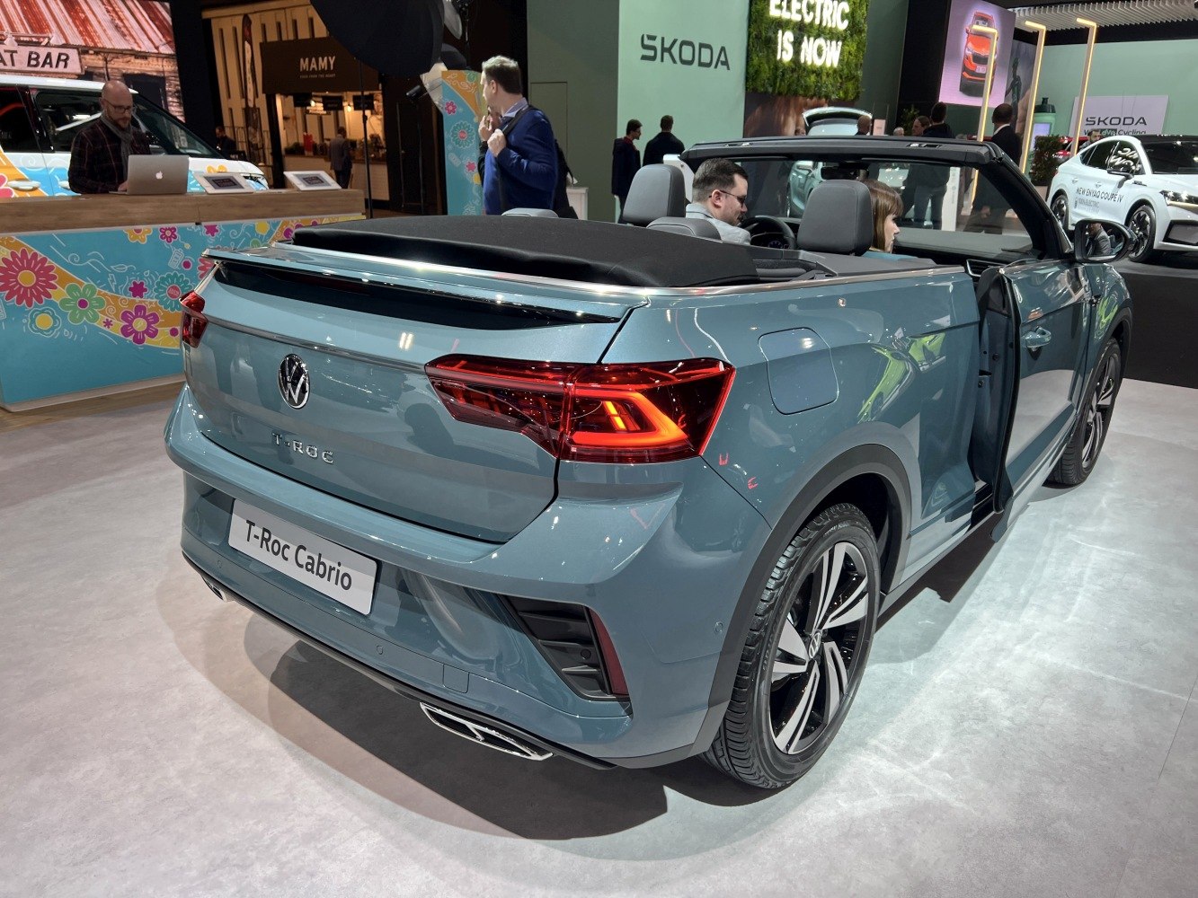 Rear view of a convertible SUV with open roof and LED taillights