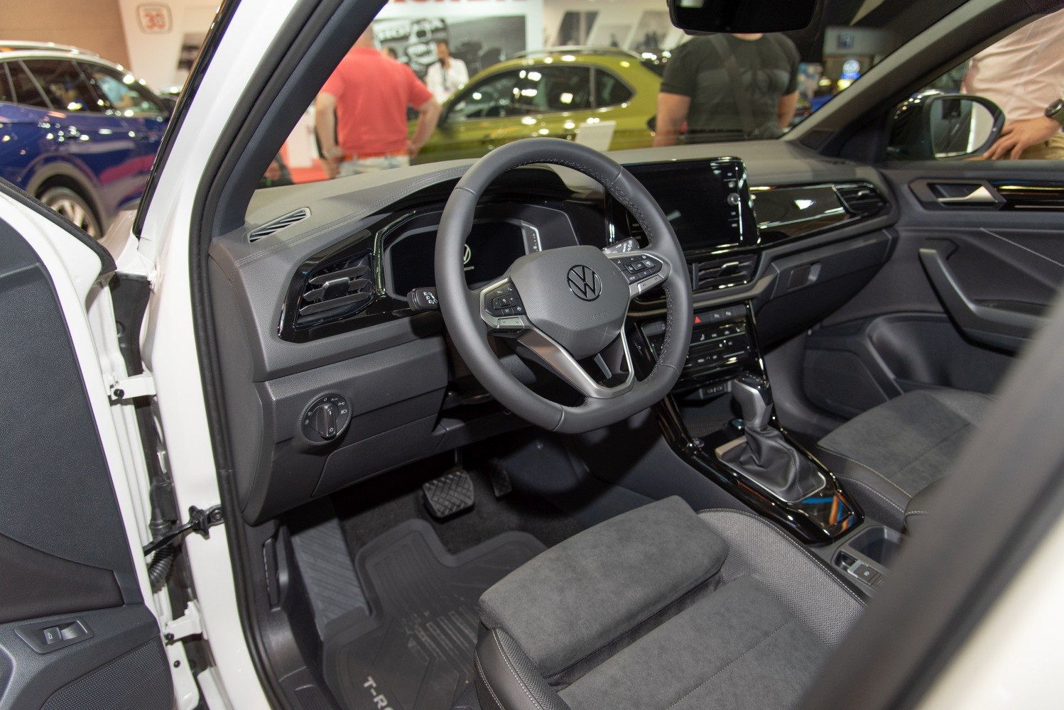 Modern steering wheel and dashboard in car interior