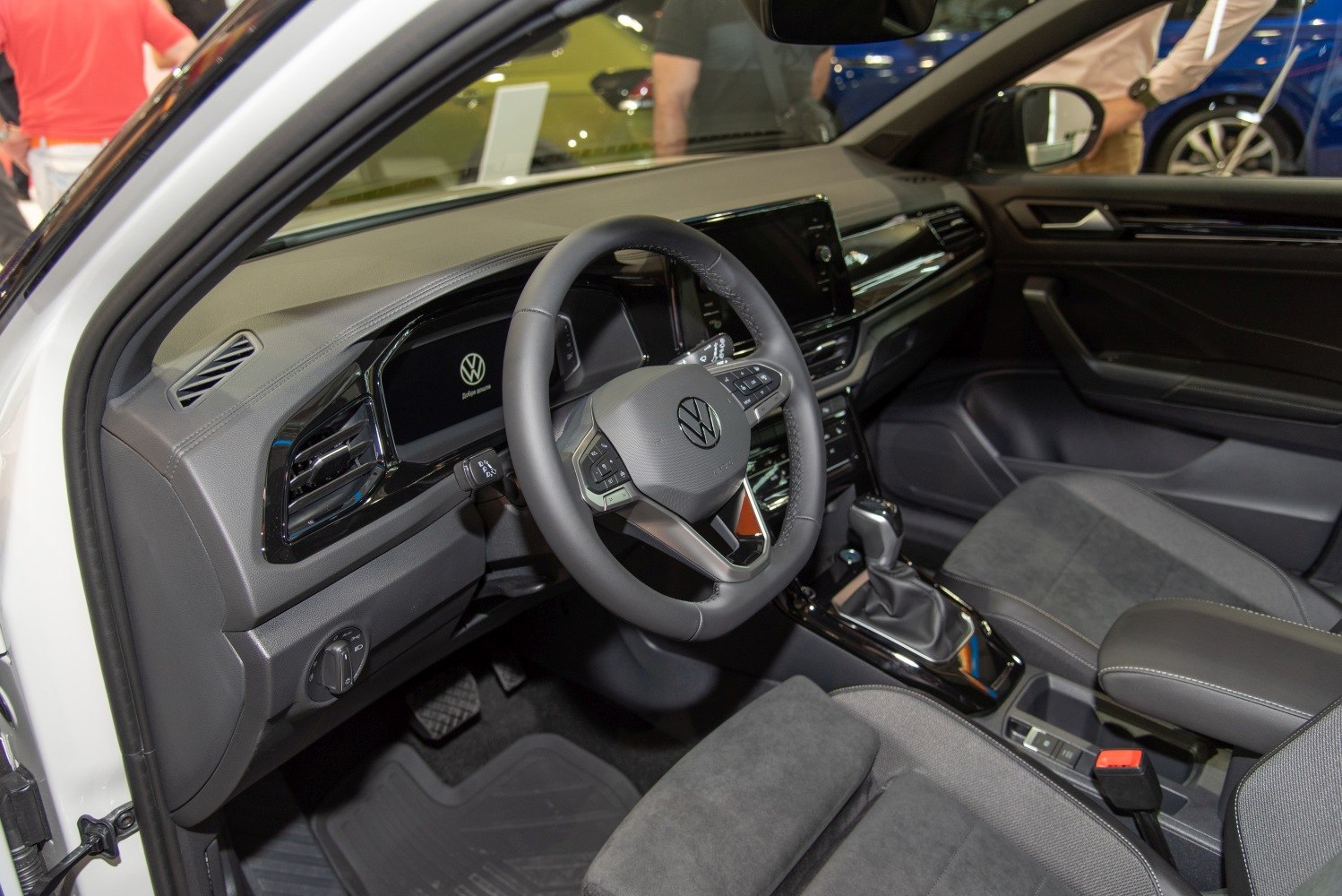 Digital instrument cluster and multifunction steering wheel in car interior
