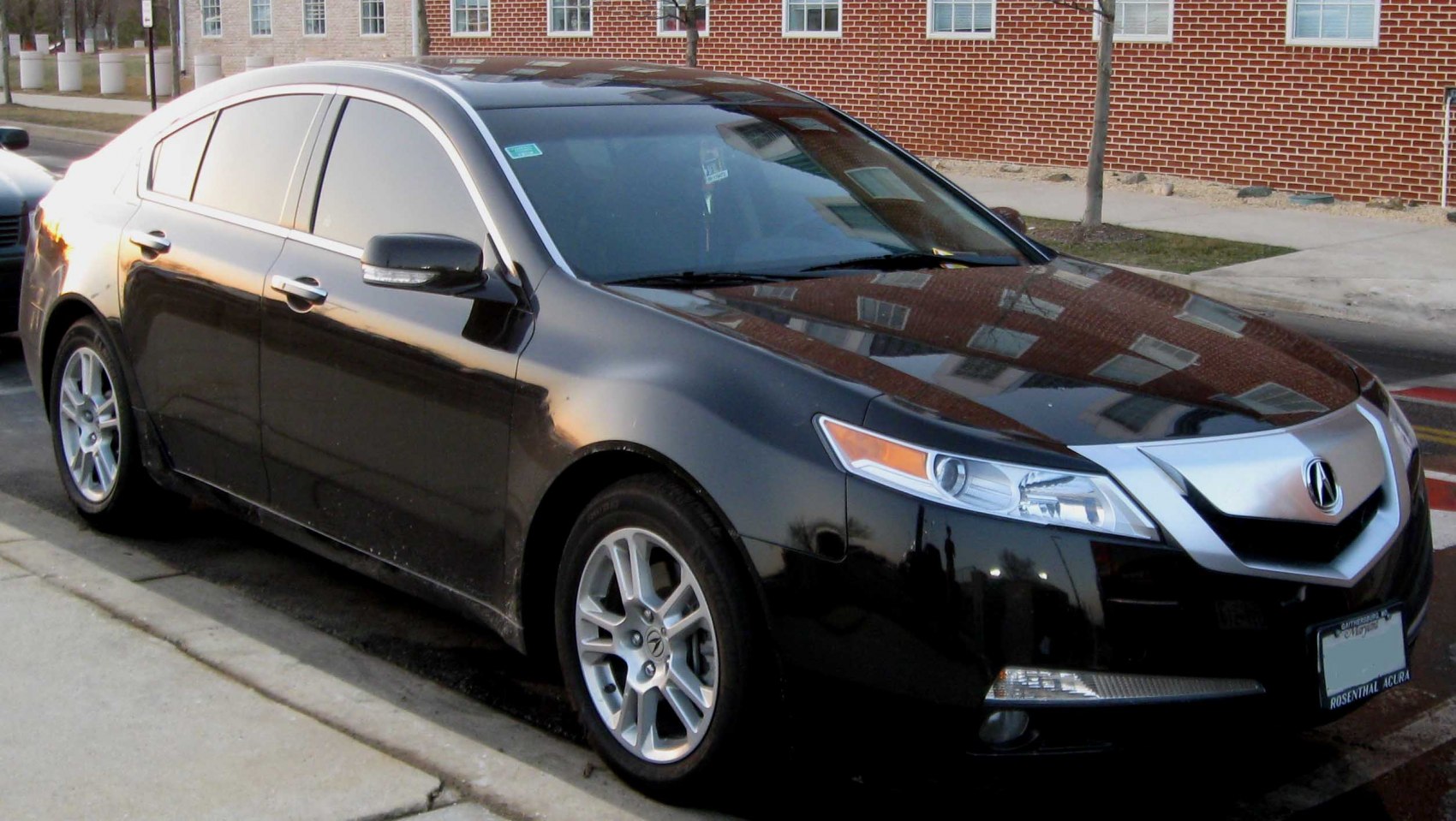 Front side profile with signature grille and alloy wheels