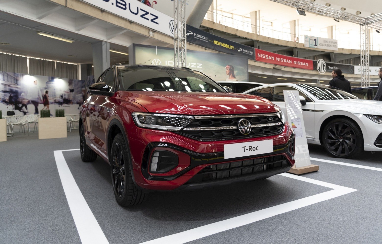 Red SUV front with black grille and LED headlights