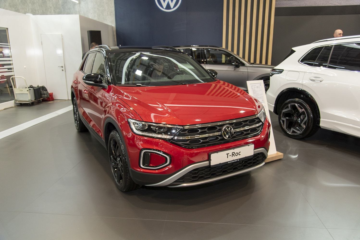 Red Volkswagen T-Roc facelift 2022 front with black roof in showroom
