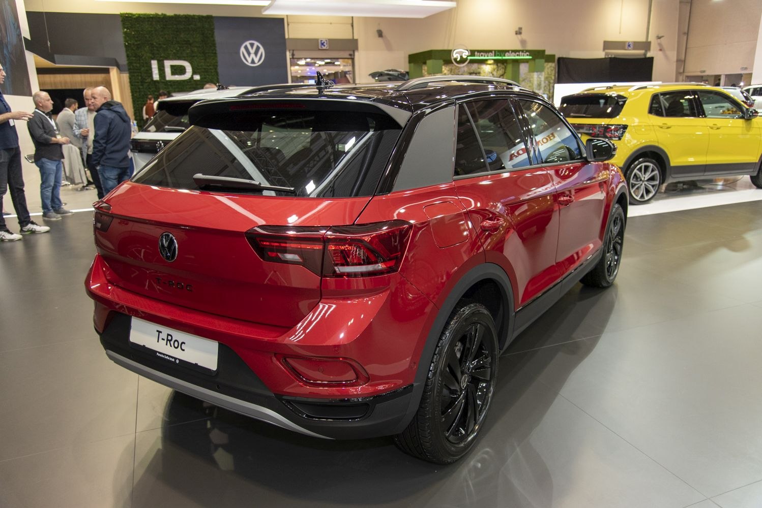 Red SUV rear view with black roof and black alloy wheels