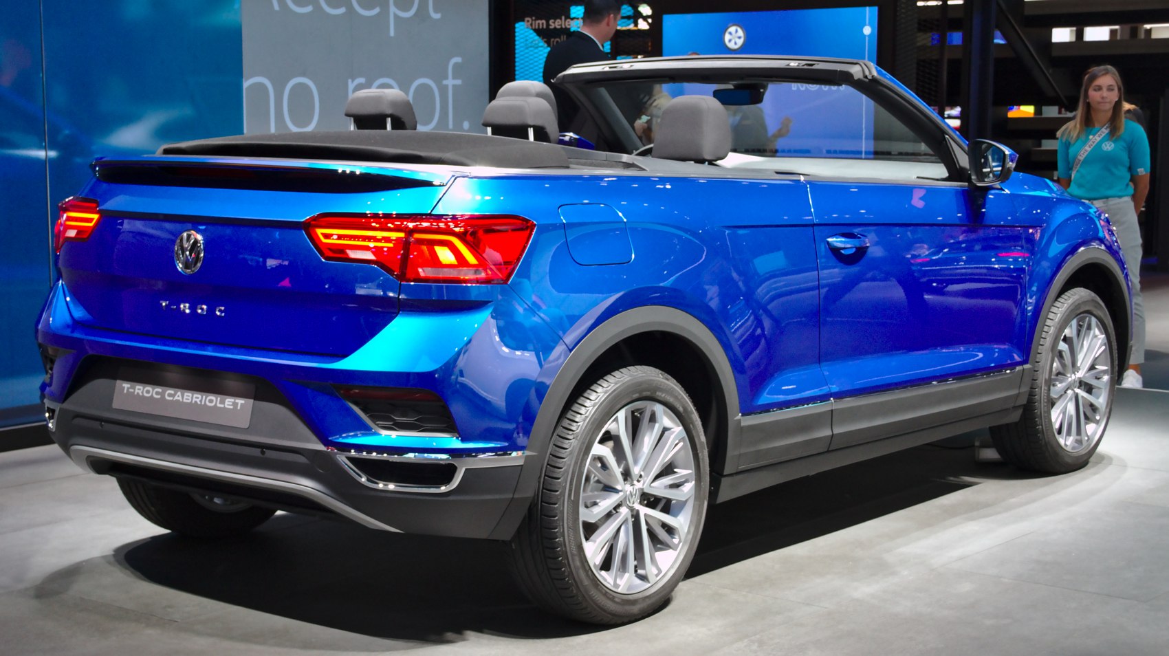 Rear view of convertible SUV with distinctive taillights and blue body