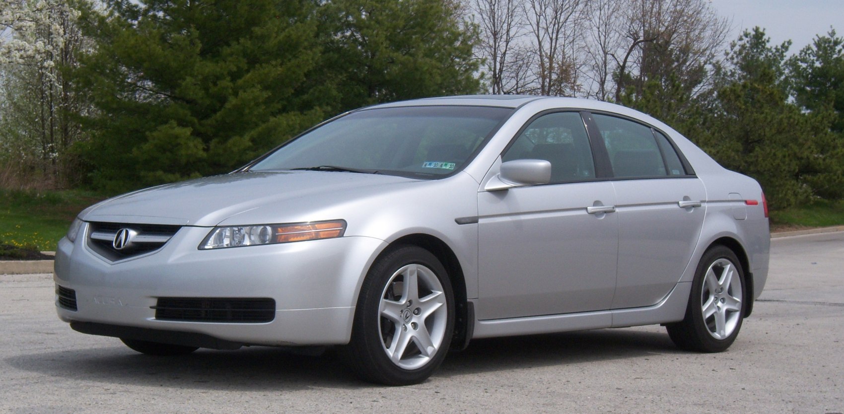 Front quarter view of a silver sedan with alloy wheels