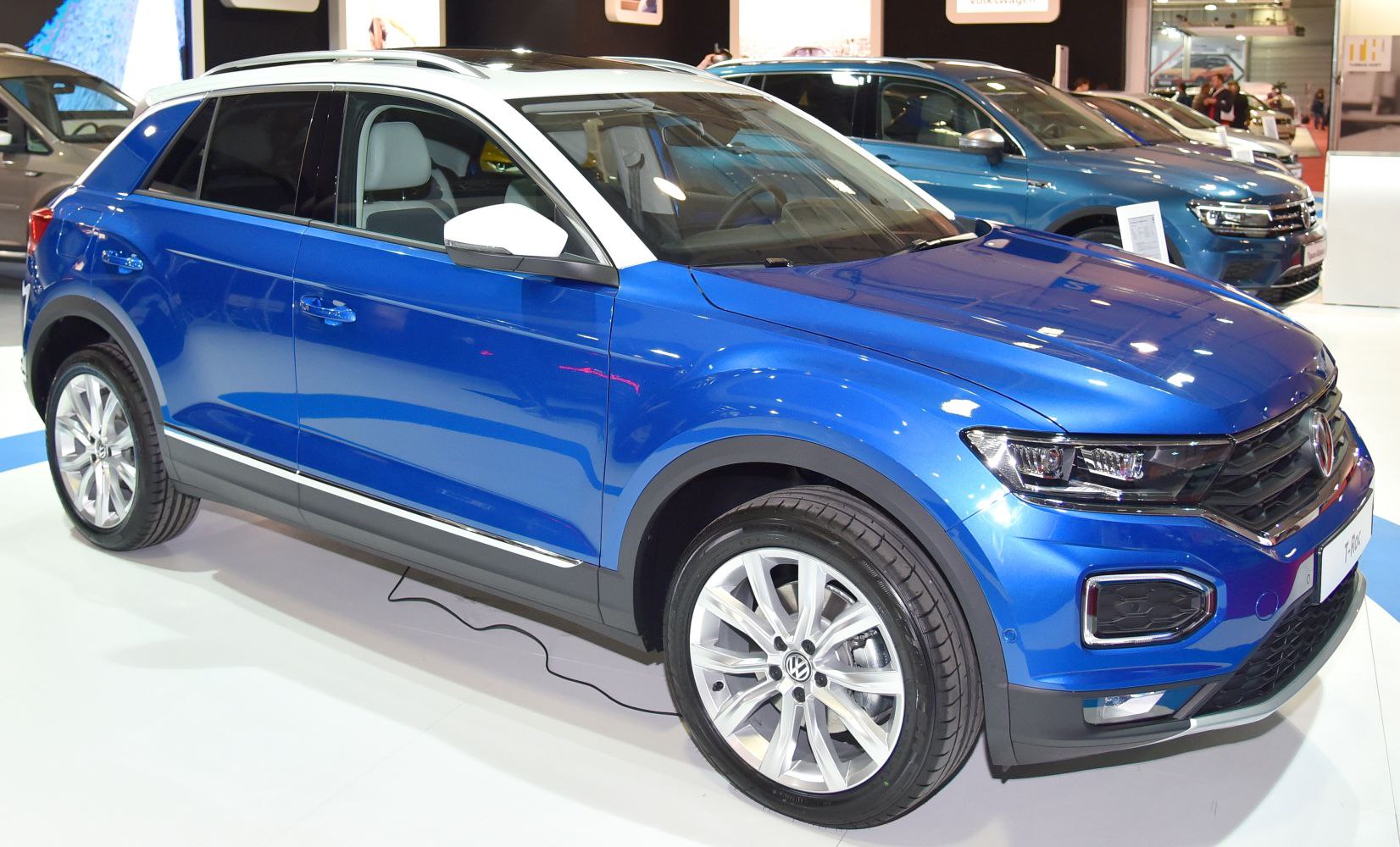 Blue SUV with white roof, LED headlights, alloy wheels.