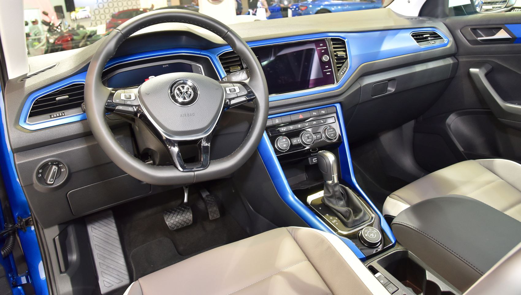 Modern dashboard and steering wheel with gear shift and climate control