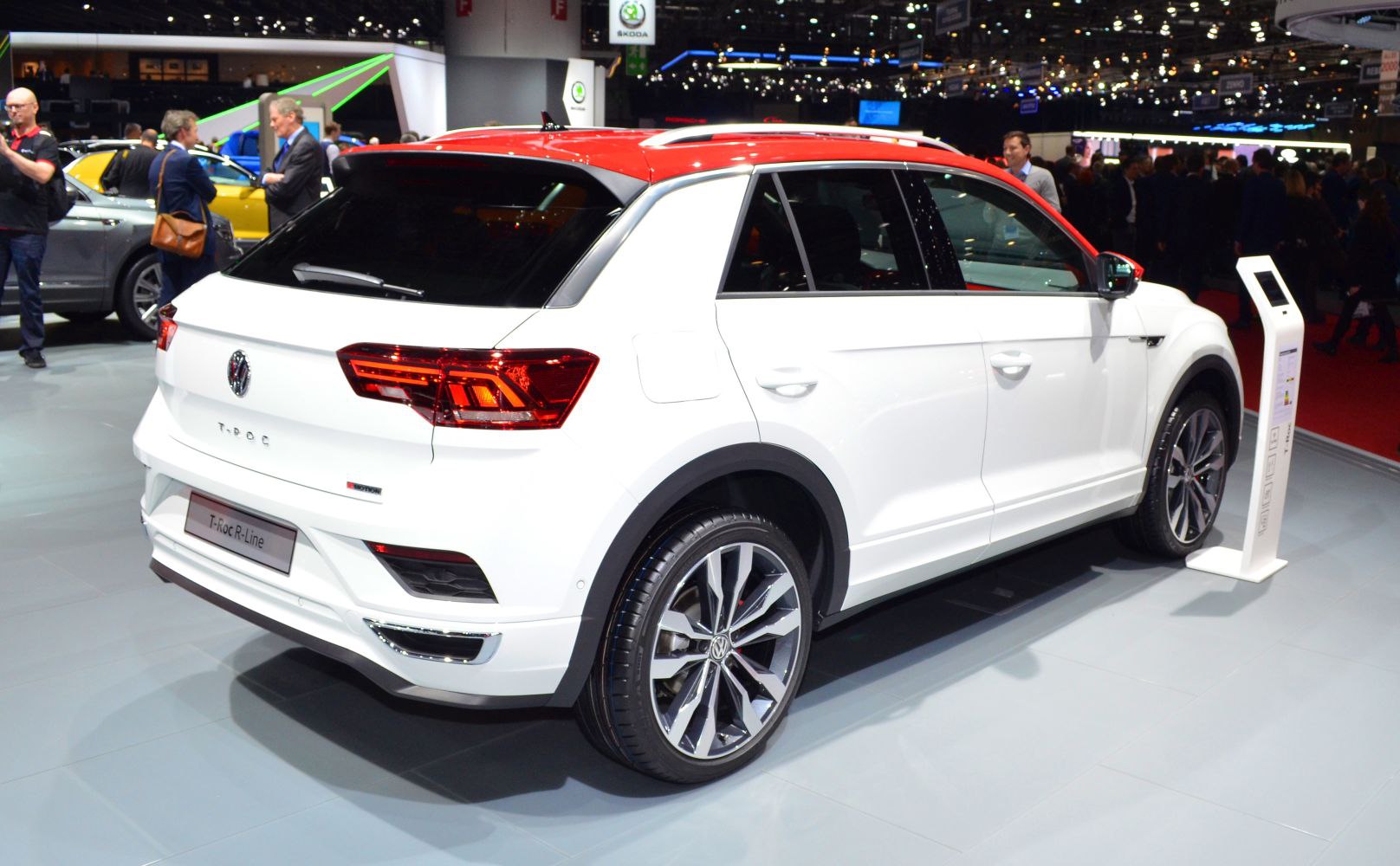 White crossover with red roof, alloy wheels, rear and side design