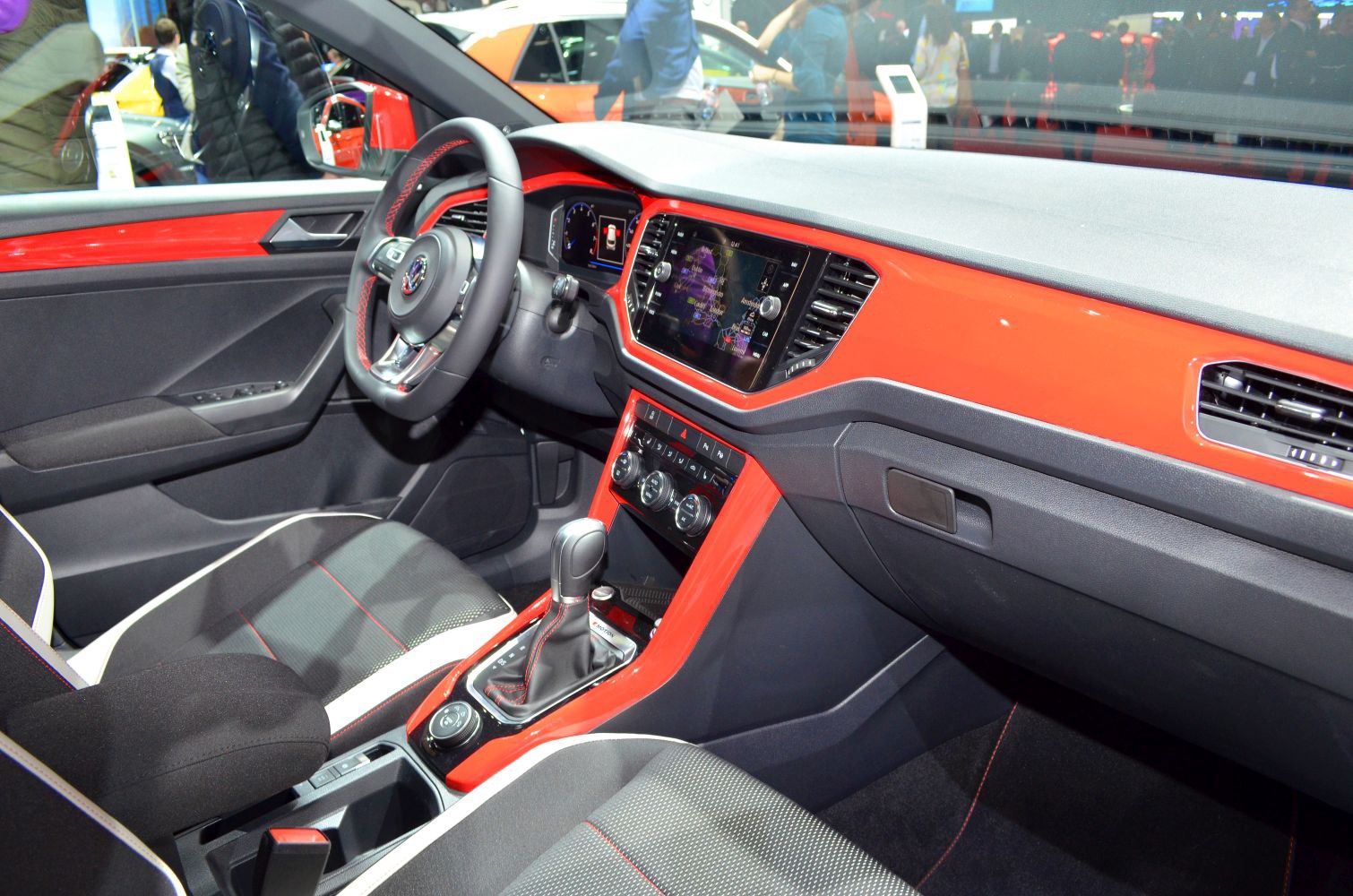 Red dashboard with digital display and modern cabin interior