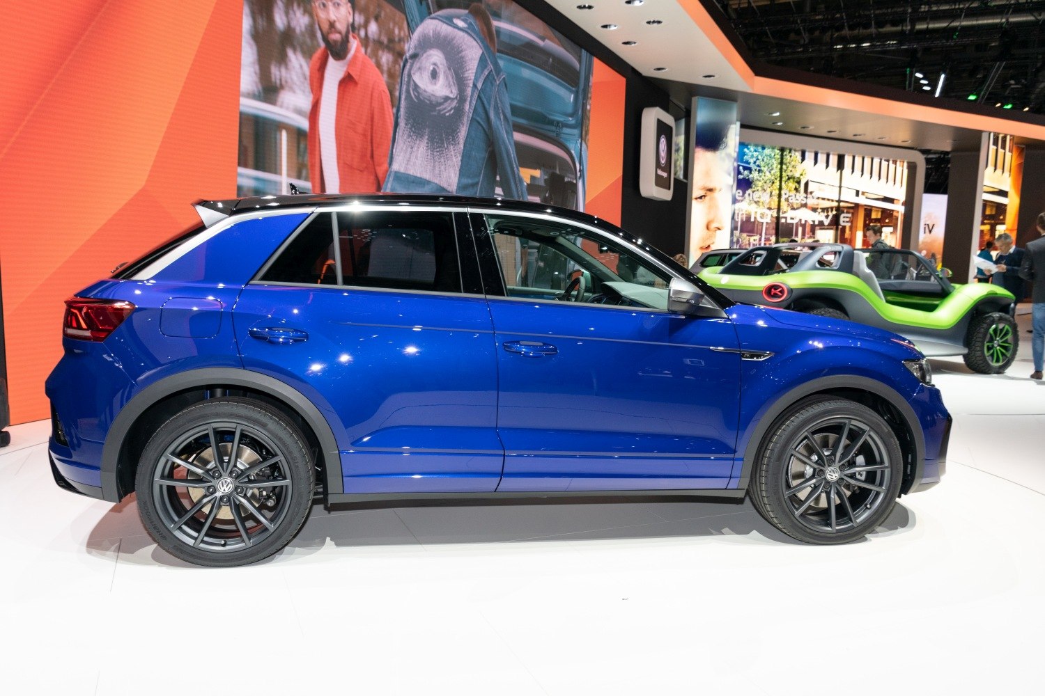 Side profile of a compact SUV with black alloy wheels
