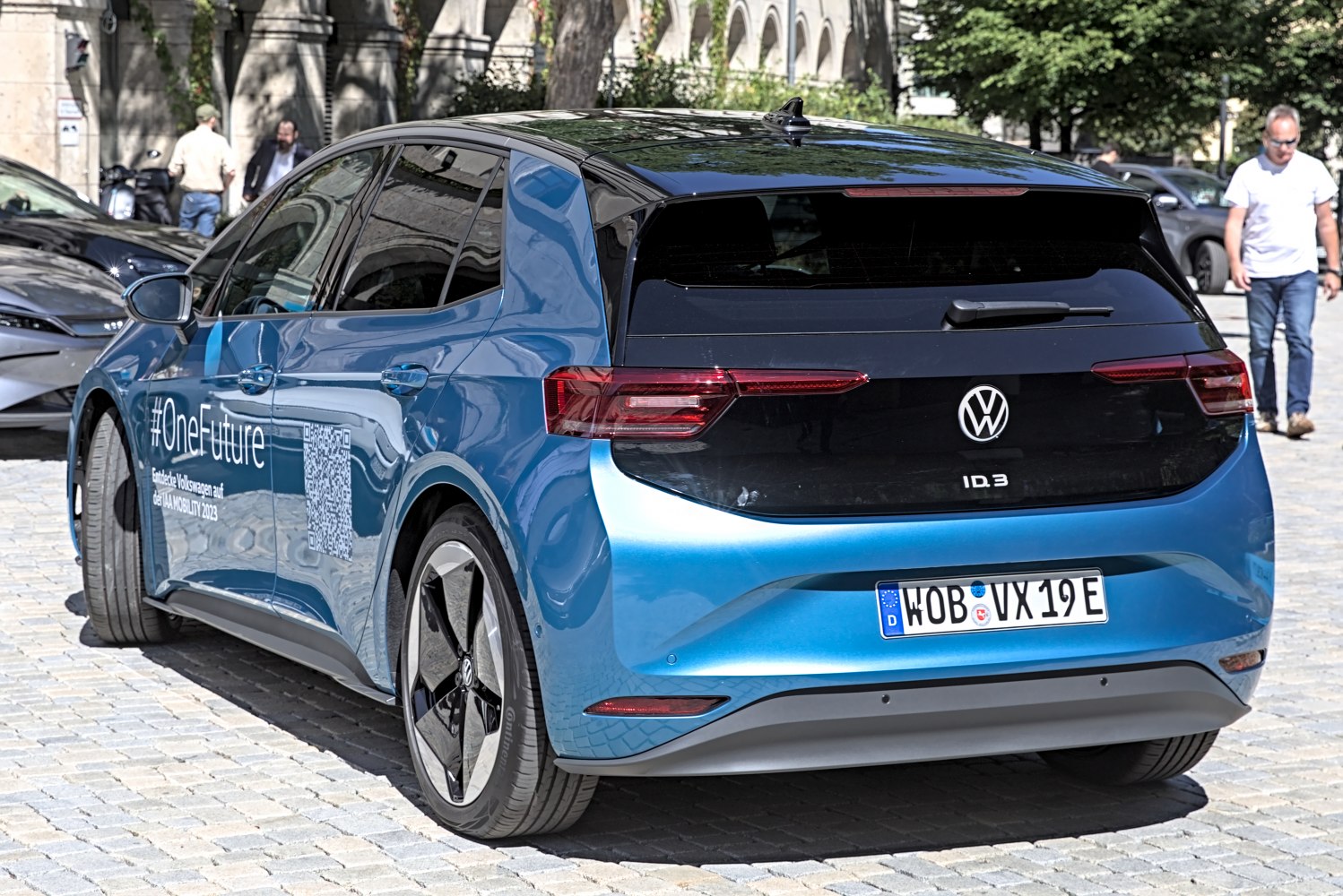Rear view of electric hatchback with modern tail lights and sleek roof spoiler