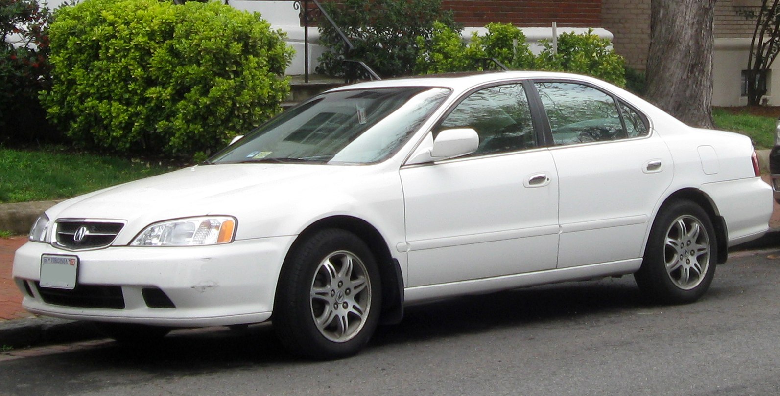 White sedan with front and side view, alloy wheels