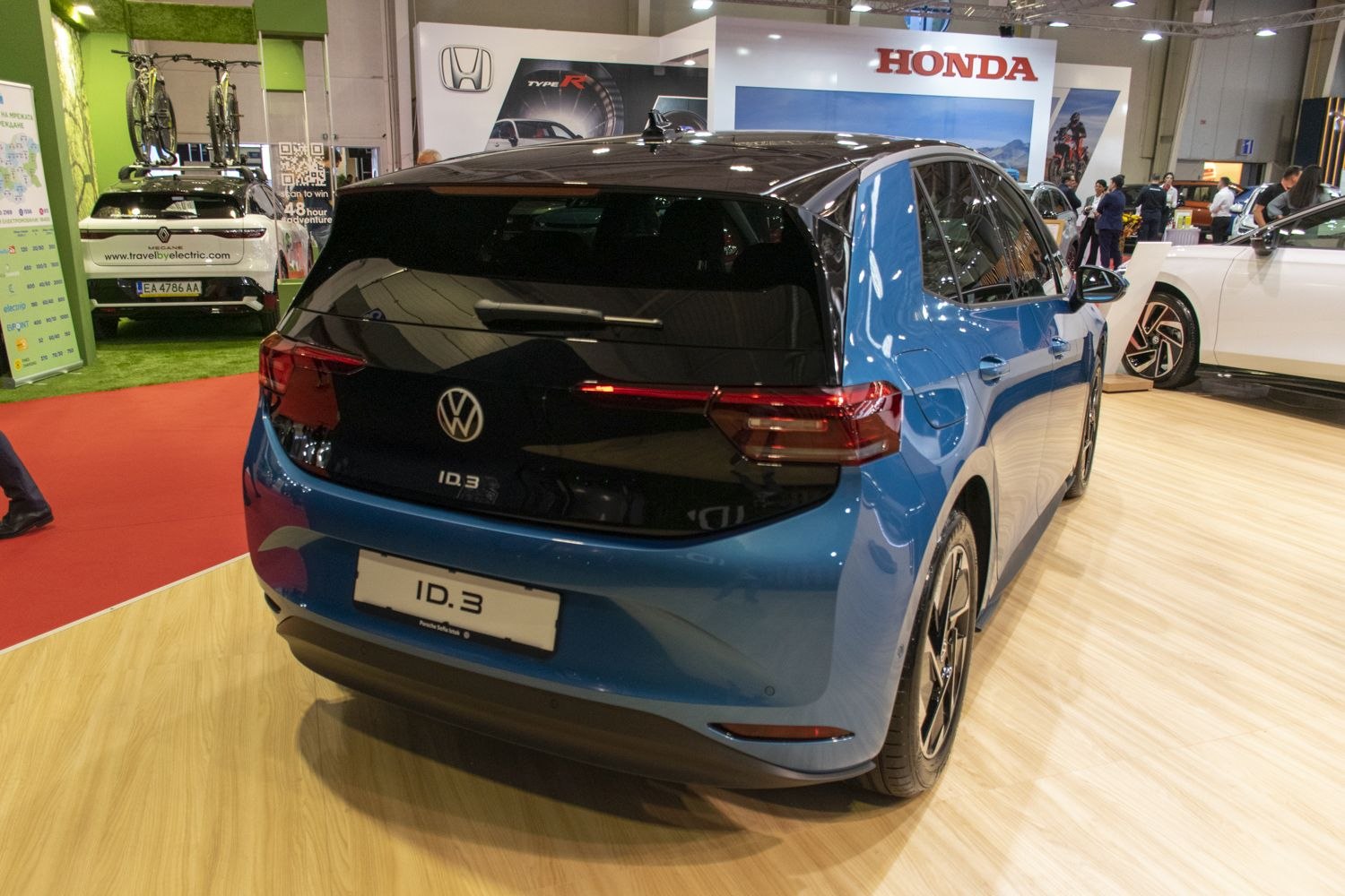 Rear view of modern electric hatchback with sleek taillights and black hatch