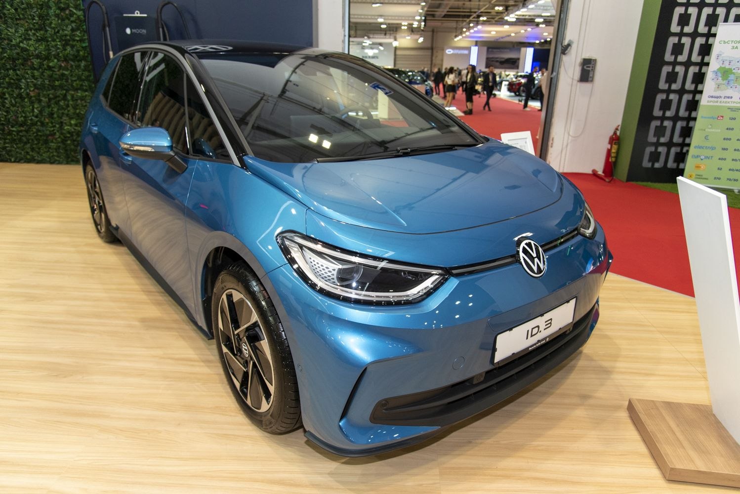 Front angled view of a modern electric hatchback with LED headlights