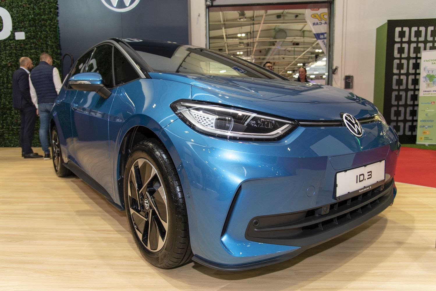 Front view showing modern LED headlights and sleek electric hatchback design