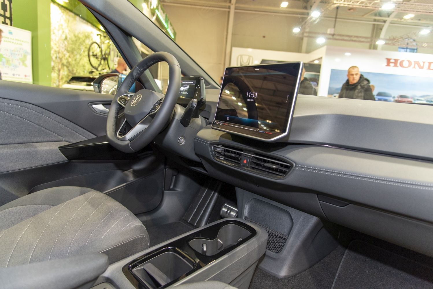 Modern digital dashboard and infotainment display with steering wheel and center console