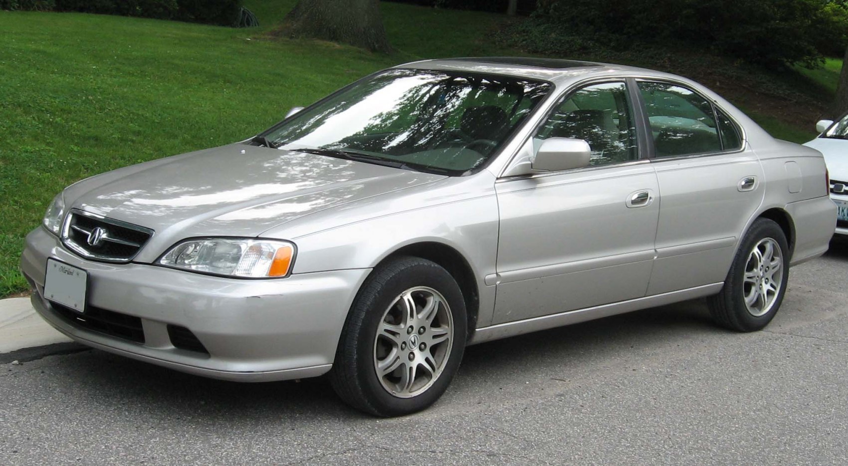 Silver mid-size sedan with alloy wheels and sunroof