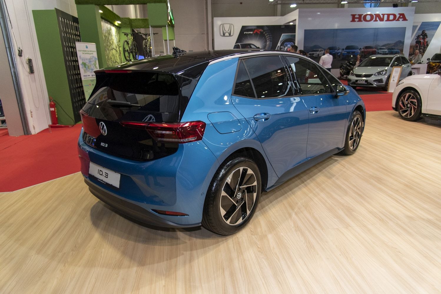 Rear view of electric hatchback with distinctive taillights and alloy wheels