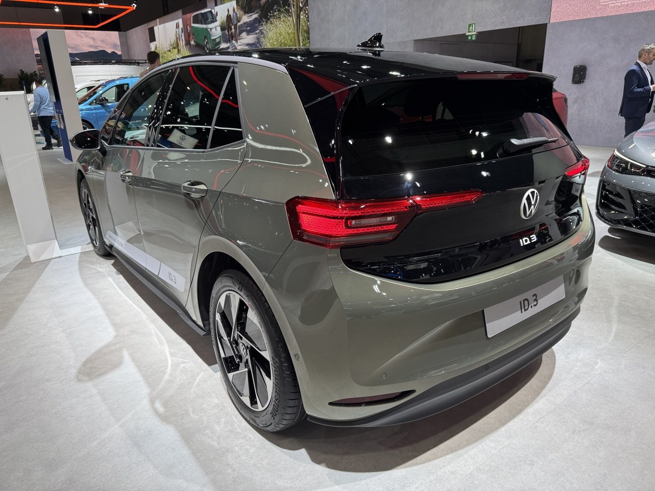 Rear and side view showcasing modern electric hatchback with LED taillights and alloy wheels.