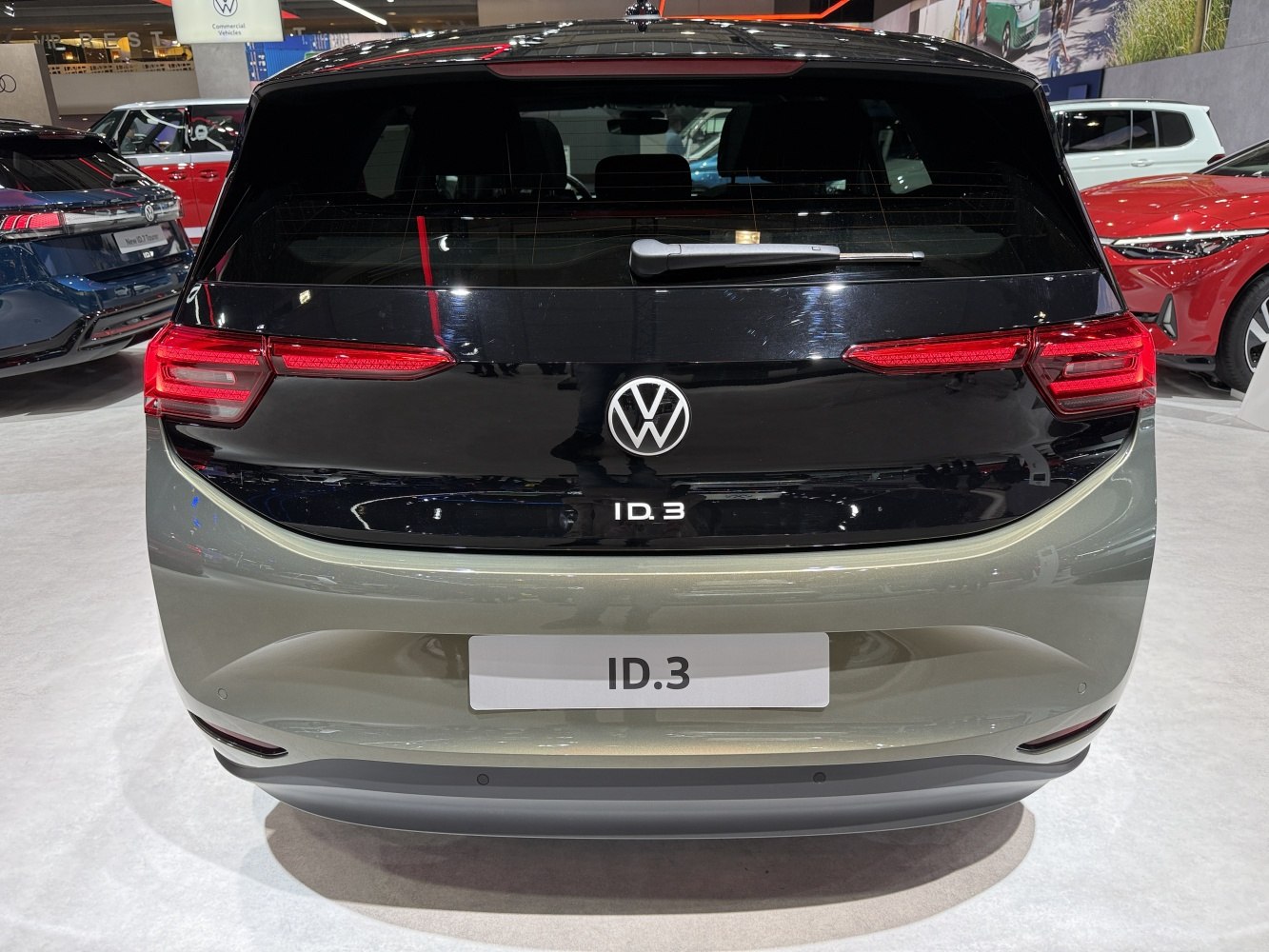 Rear view of a modern electric hatchback with sleek LED taillights and hatchback design