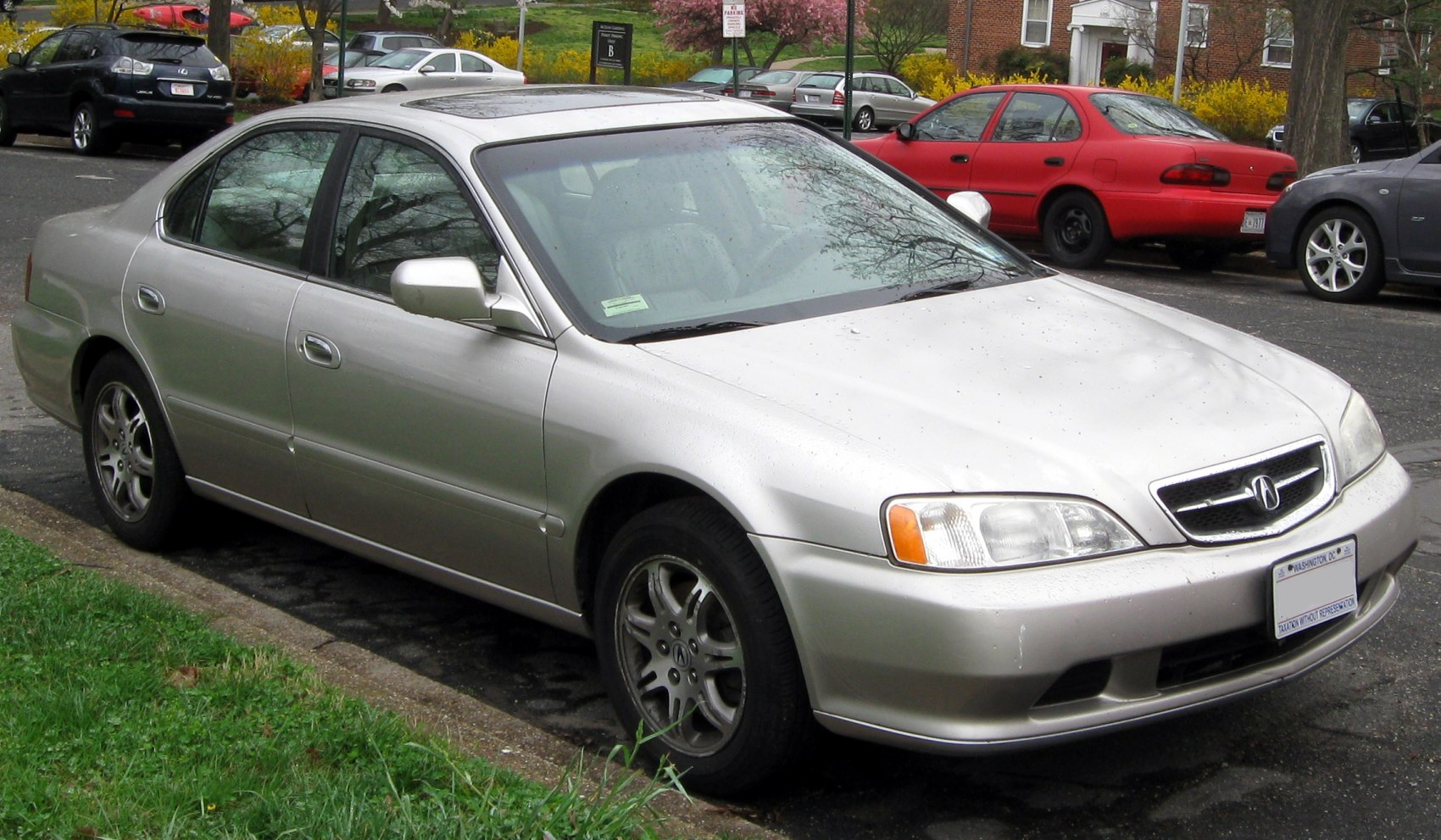 Silver mid-size sedan with sunroof and alloy wheels