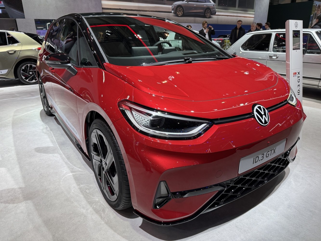 Front view of electric hatchback with LED headlights and sporty grille