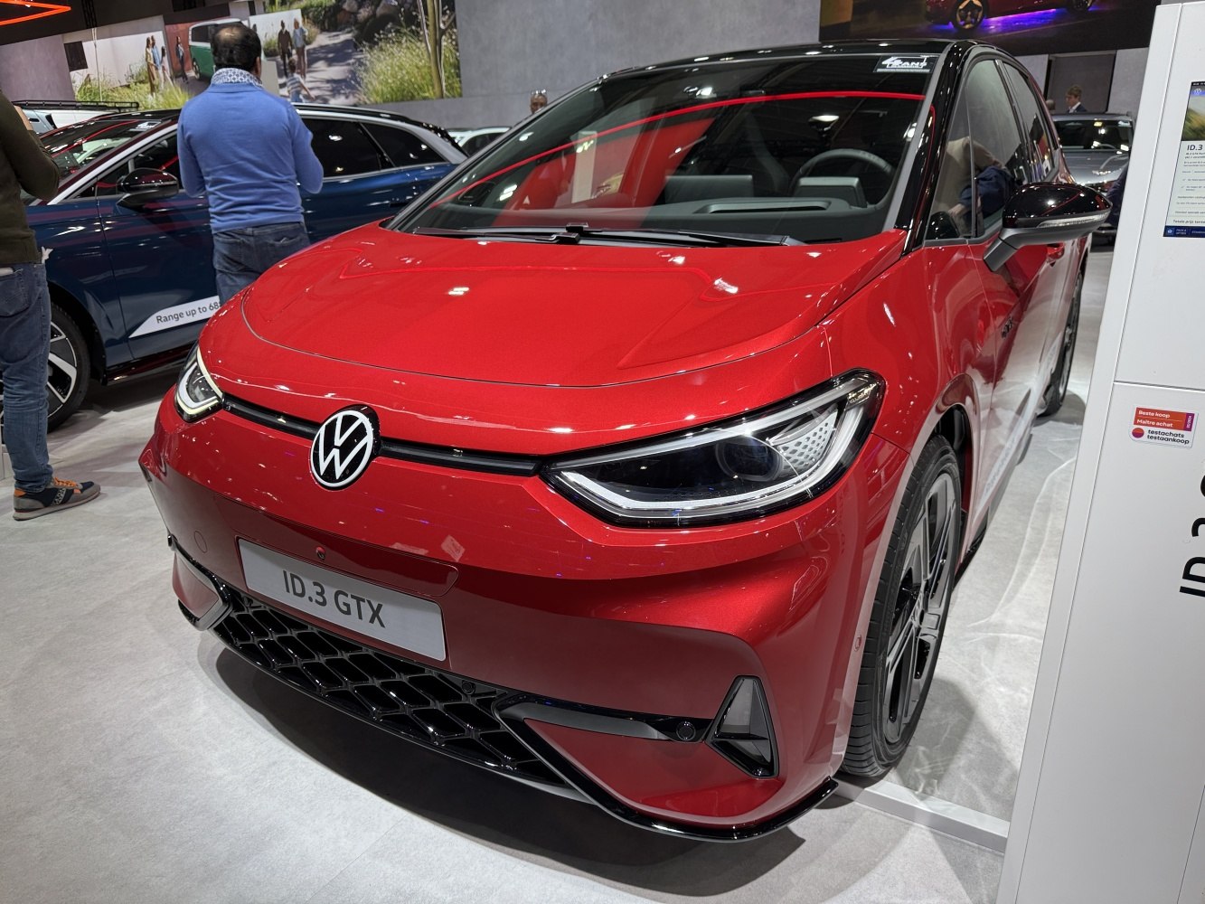 Front view with sleek headlights and sporty grille of modern electric hatchback