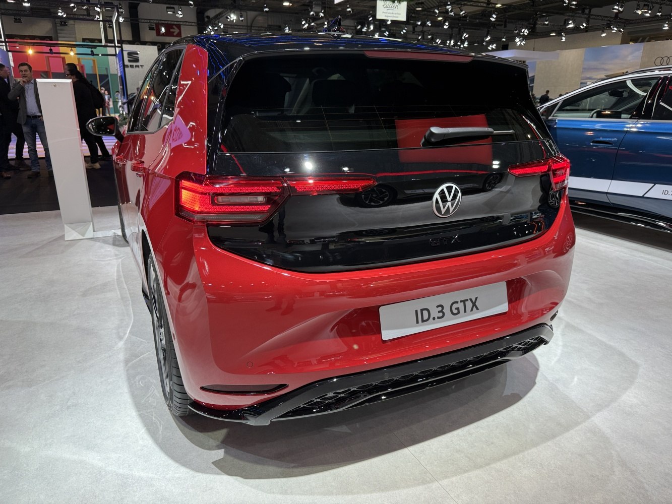 Red electric hatchback rear with LED taillights and black rear hatch