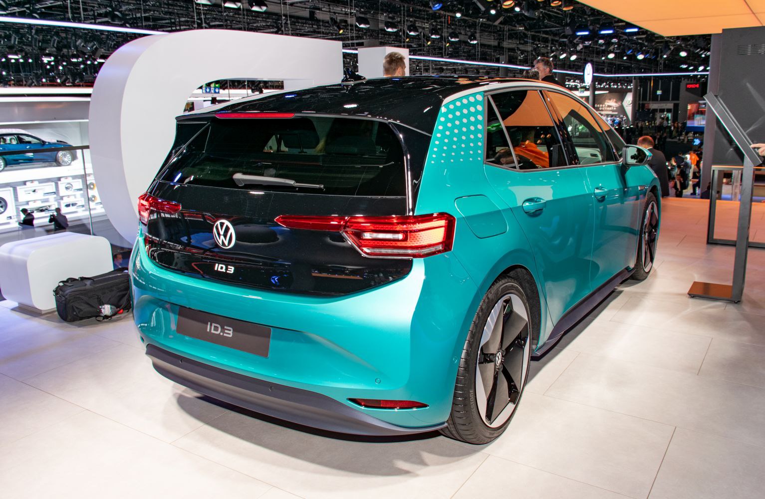 Rear electric hatchback with unique taillights and aerodynamic rims