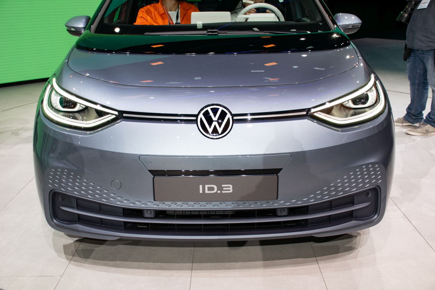 Close-up of front LED headlights and sleek grille design.