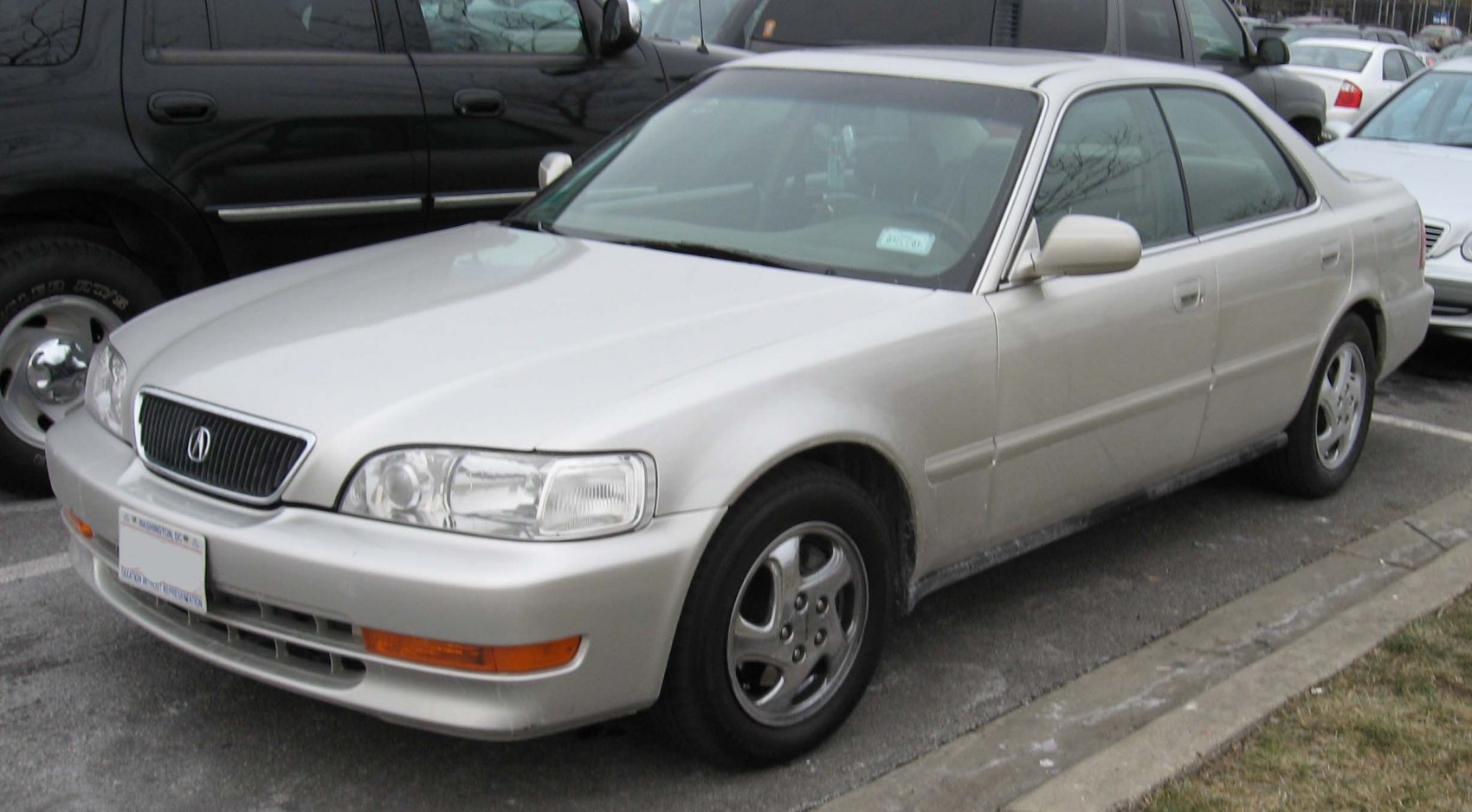 Silver four-door sedan showing front and side perspective