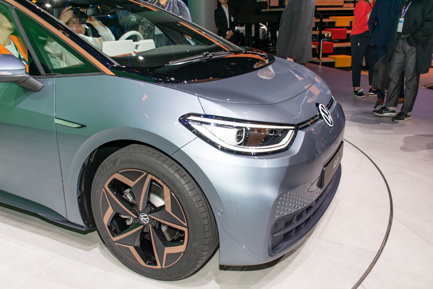 Close-up of front headlight and alloy wheel design