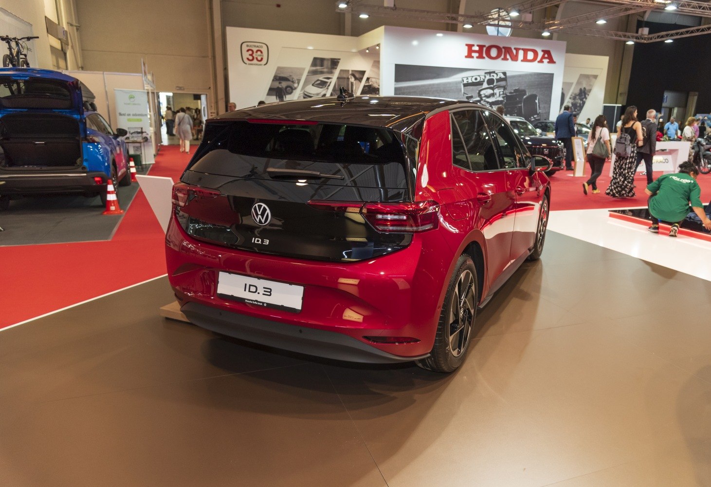 Rear view of an electric hatchback with black and red contrast