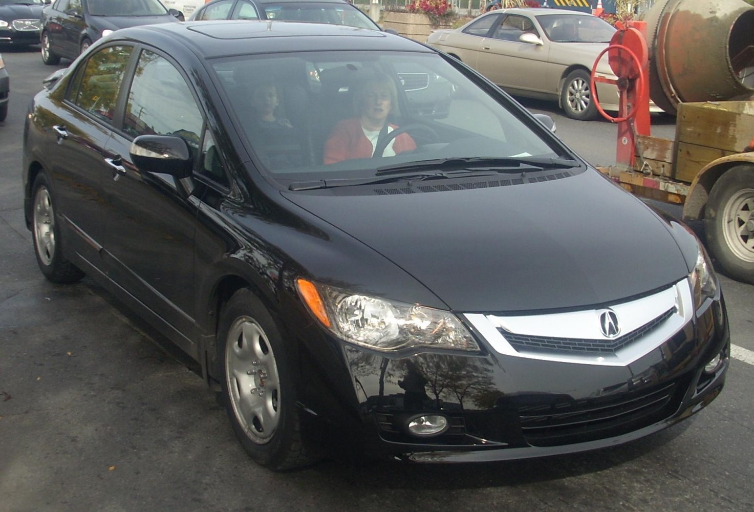 Front-left view showing chrome grille and headlights