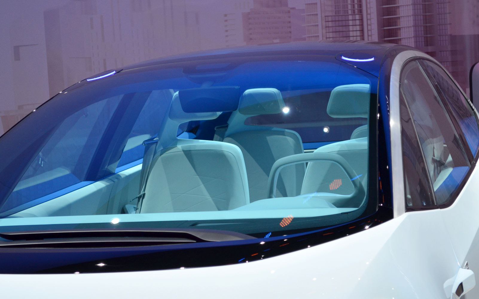 Futuristic car interior with unique steering wheel and modern seats